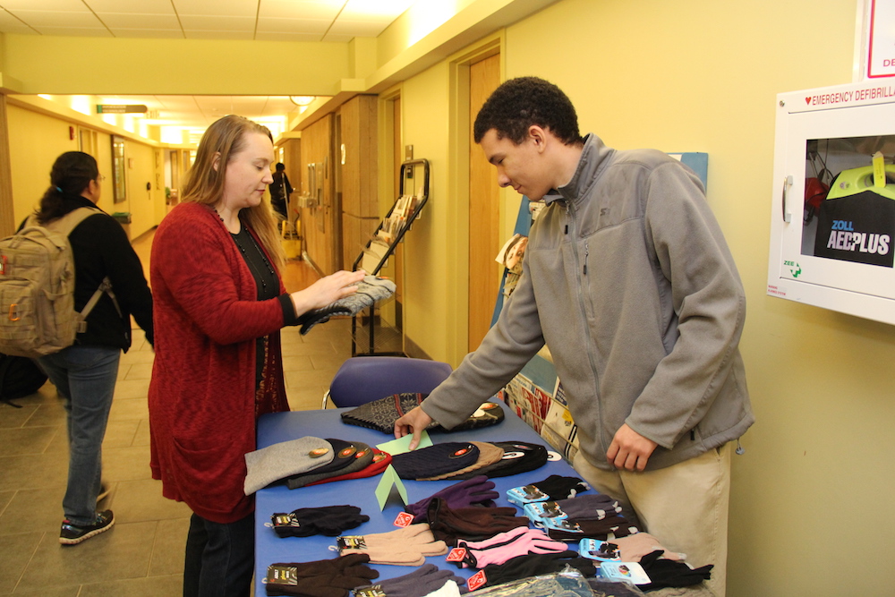 A student entrepreneur sells his products